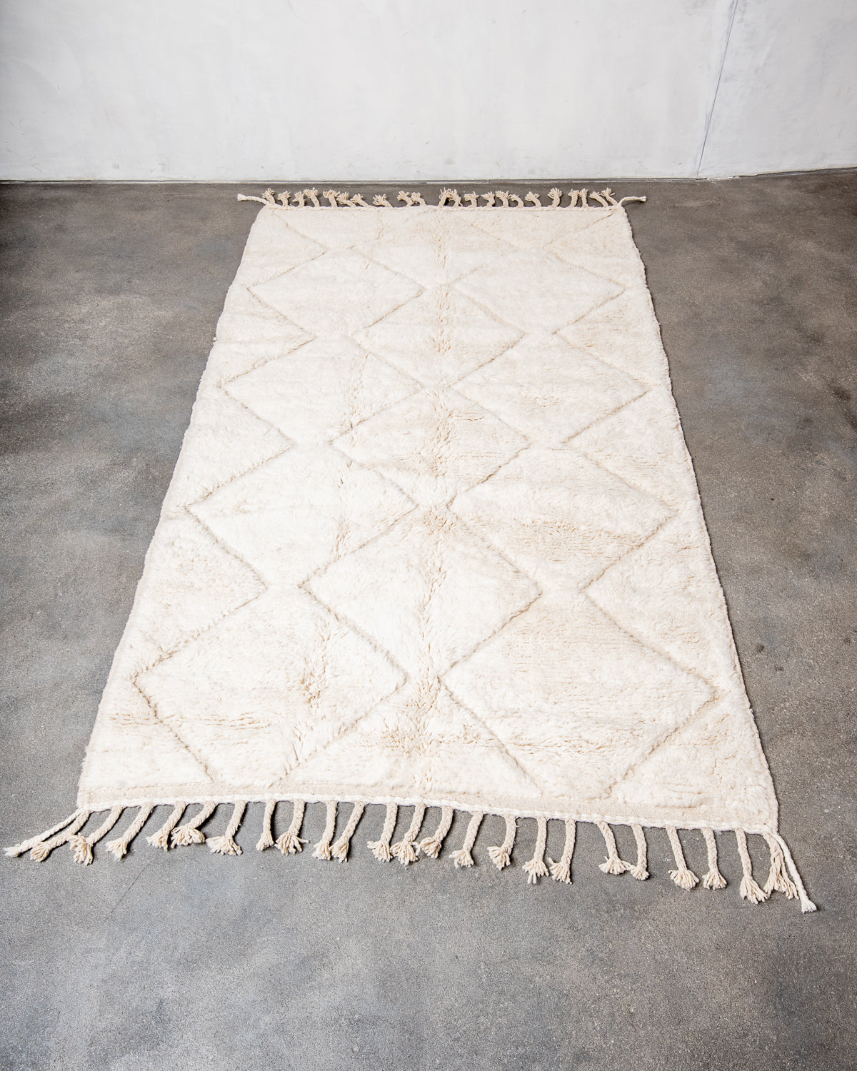 Modern, designer, handcrafted Berber rug from Morocco. Beniourain carpet with minimalist design, natural wool pile and a fluffy texture.
